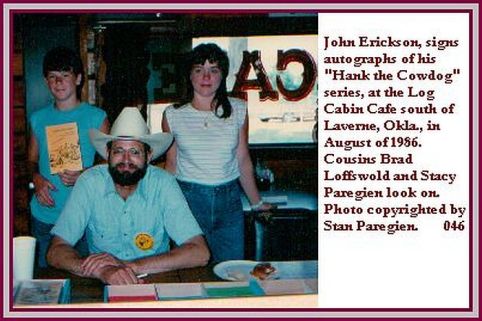 Western author and entertainer John Erickson, creator of the "Hank the Cowdog" series of books and songs and more. Behind him are Stacy Paregien and her California cousin Brad Loffswold. Photo taken at the Log Cabin Cafe south of Laverne, Okla., in 1986 by Stan Paregien
